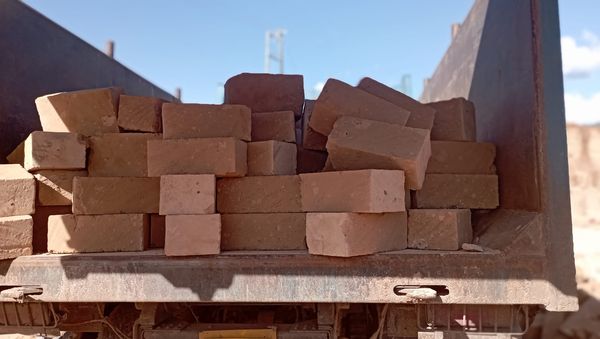 Hard yellow machine-cut building stones stacked at Narok quarry, supplied by Shemcut.com